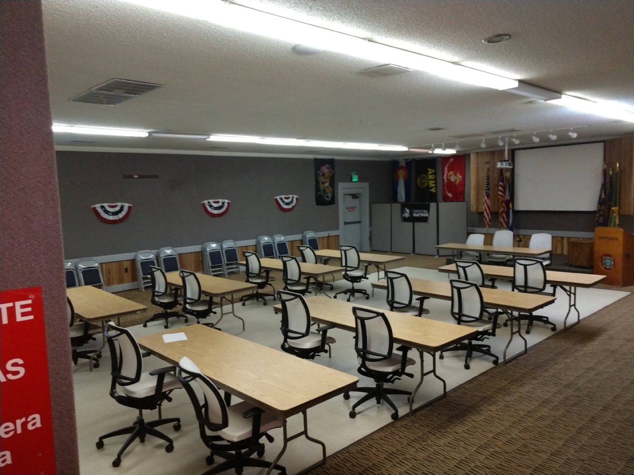 The hall is set up in a conference or classroom format.